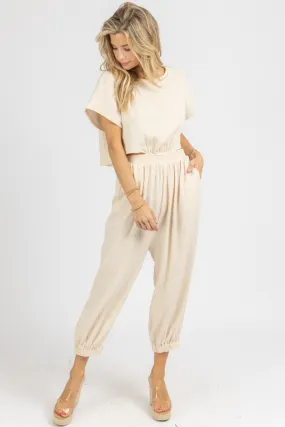 TAUPE GAUZE OPEN BACK JUMPSUIT